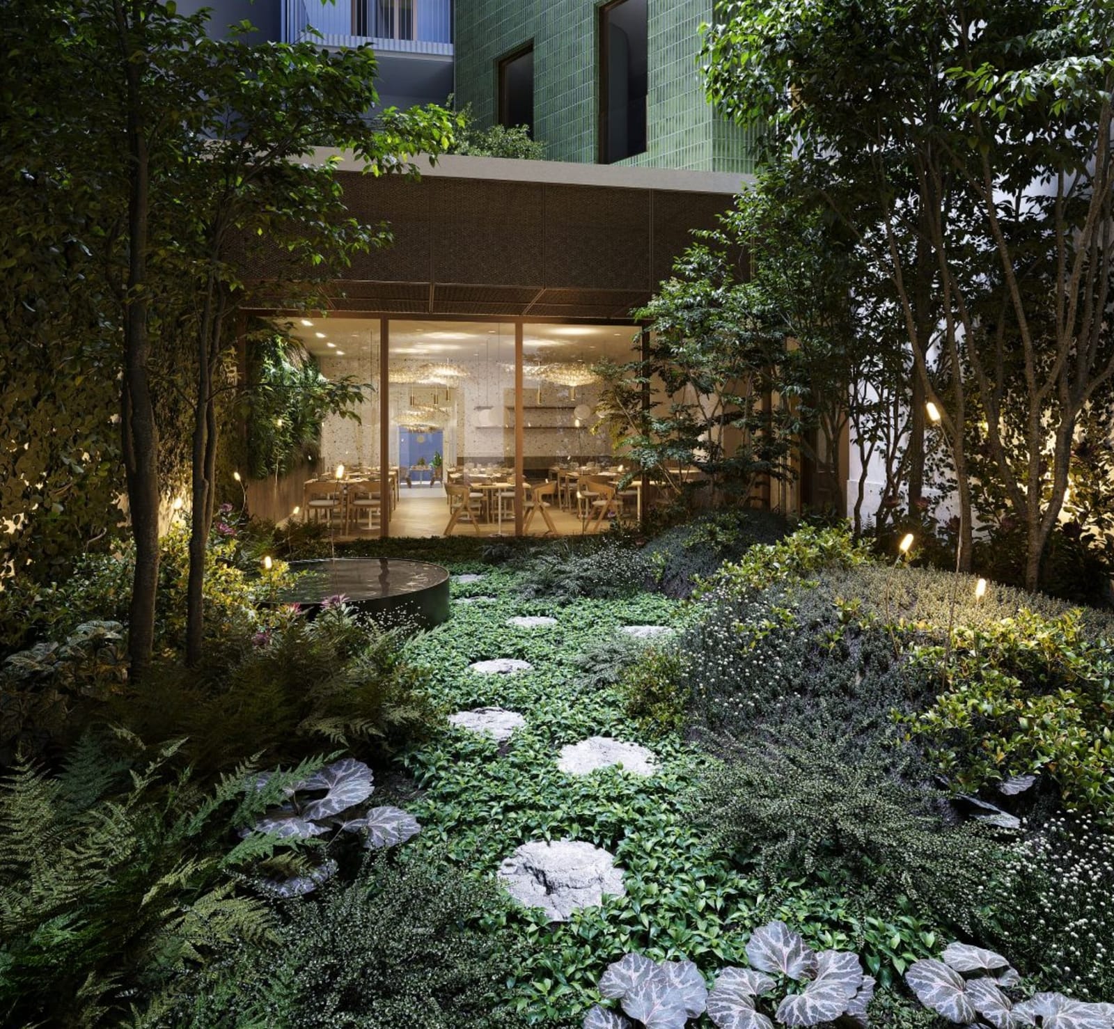 Green Dream Hotel Budapest — courtyard garden at dusk, restaurant glowing beyond